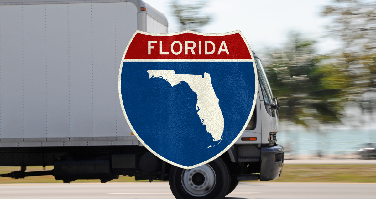 people in a moving truck on their way to Florida